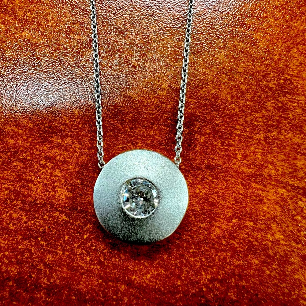 Costume jewelry. Hanging pendant with cubic zirconia detail. 16” chain